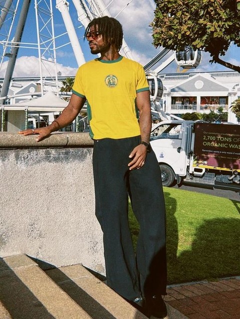 Reclaimed Vintage cropped boxy ringer t-shirt with beer mat graphic in yellow and green